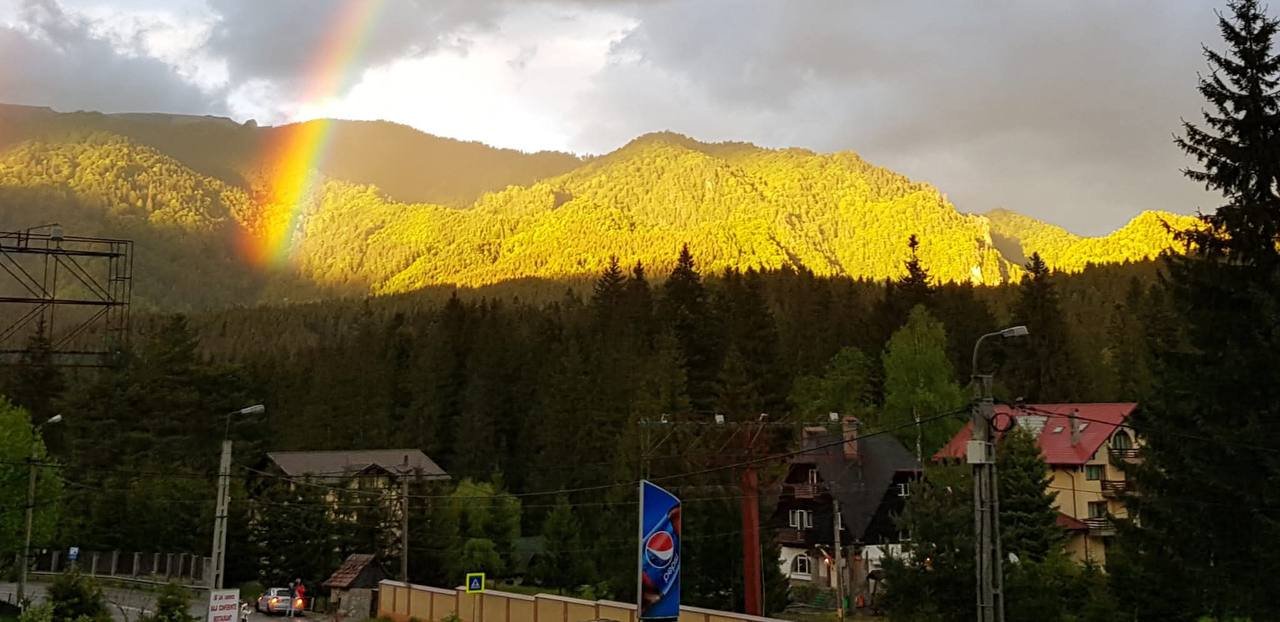 Villa surroundings — golden hour with rainbow