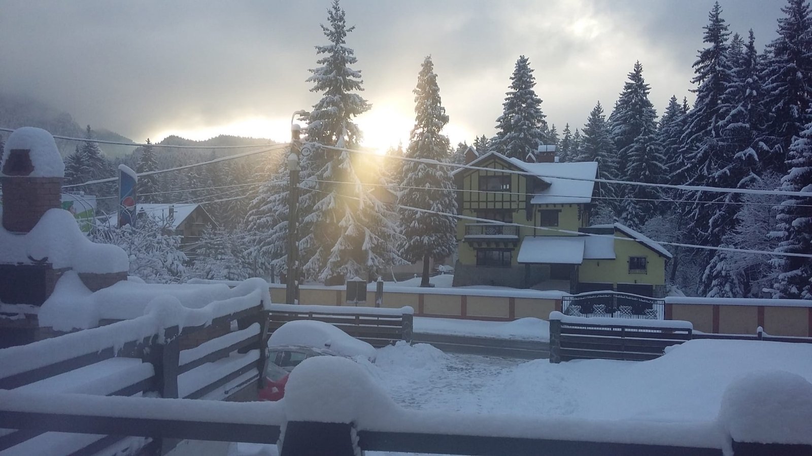 Villa surroundings — sunrise over the snow-covered village